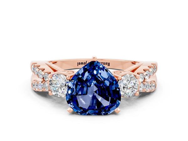 Rose gold Heart Cut Blue Sapphire Three-Stone Ring with Pavé Split Shank and Four-Prong Setting