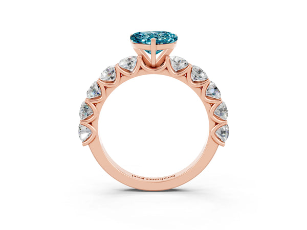 Rose gold Heart Cut Blue Topaz Prong Setting with Side Stones on a Pave Band