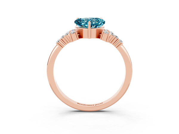 Rose gold Heart Cut Blue Topaz Ring with Side Stones and Four-Prong Setting