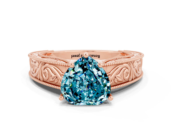 Rose gold Heart Cut Blue Topaz Solitaire Ring with Engraved Band and Four-Prong Setting