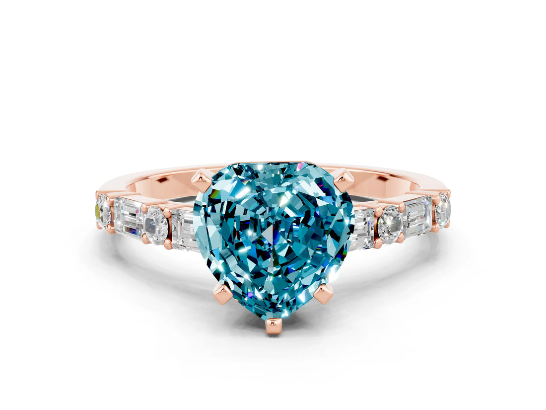 Rose gold Heart Cut Blue Topaz Solitaire with Side Baguettes and Channel Set Band