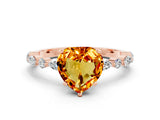 Rose gold Heart Cut Citrine Solitaire with Side Stones on a Pavé Band and Four-Prong Setting