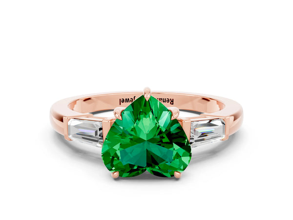 Rose gold Heart Cut Emerald Three-Stone Ring with Tapered Baguette Side Stones and Prong Setting