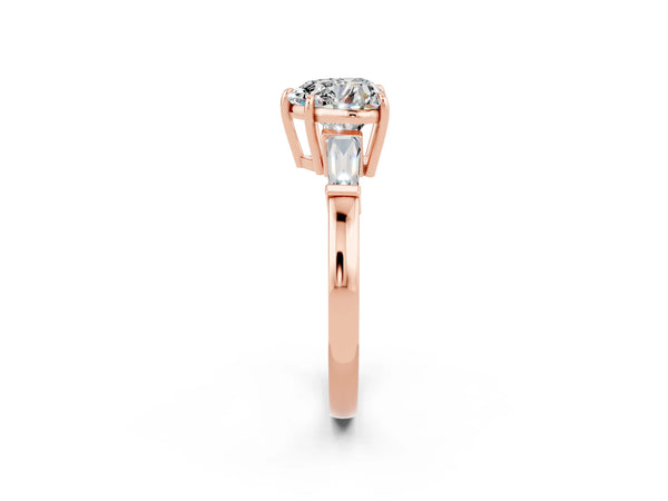 Rose gold Heart Cut Moissanite Three-Stone Ring with Tapered Baguette Side Stones and Prong Setting