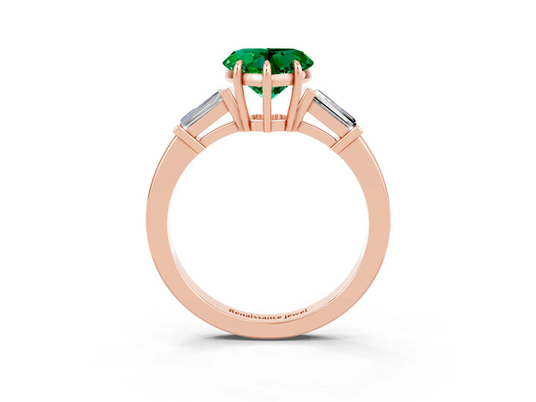 Rose gold Heart Cut Emerald Three-Stone Ring with Tapered Baguette Side Stones and Prong Setting