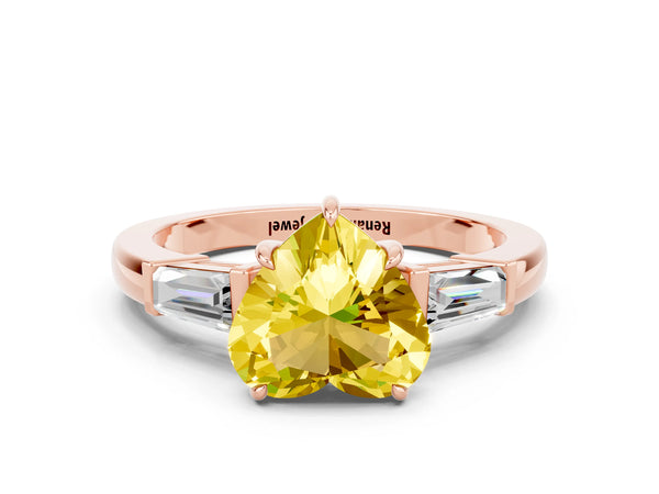 Rose gold Heart Cut Yellow Sapphire Three-Stone Ring with Tapered Baguette Side Stones and Prong Setting