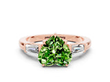 Rose gold Heart Cut Cut Diamond Ring with Tapered Baguette Side Stones in Four-Prong Setting