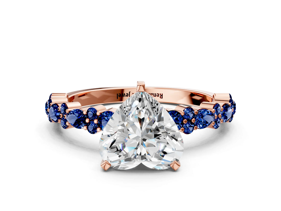 Rose gold Heart Cut Diamond Side Stone Solitaire Ring with Round with Blue Sapphire side stone and Four-Prong Setting