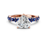 Rose gold Heart Cut Diamond Side Stone Solitaire Ring with Round with Blue Sapphire side stone and Four-Prong Setting
