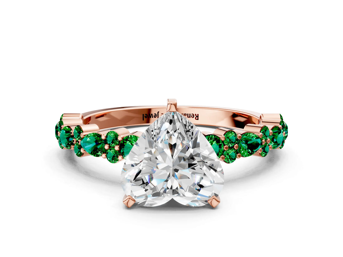 Rose gold Heart Cut Diamond Side Stone Solitaire Ring with Round with Emerald side stone and Four-Prong Setting