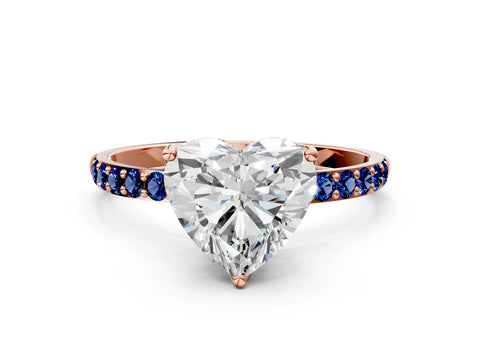 Rose gold Heart Cut Diamond Solitaire Engagement Ring with Round with Blue Sapphire side stone Pavé Band and Prong Setting