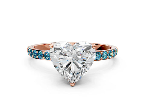 Rose gold Heart Cut Diamond Solitaire Engagement Ring with Round with Blue Topaz side stone Pavé Band and Prong Setting