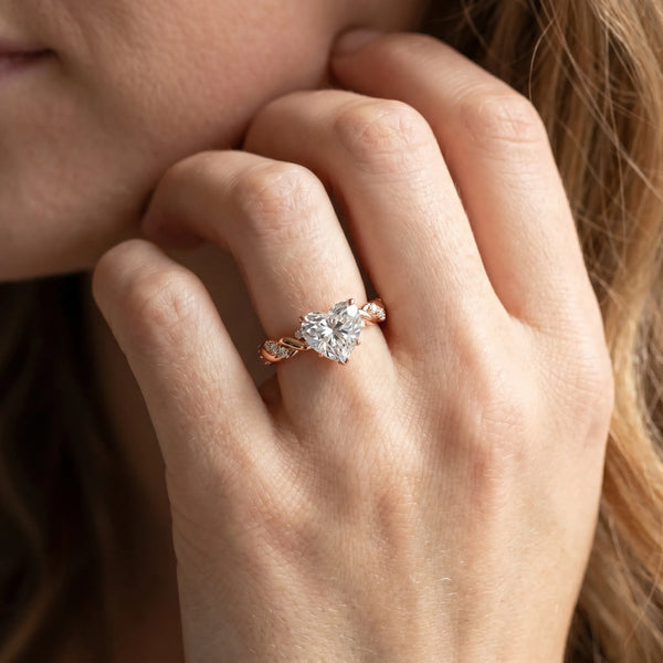 Rose gold Heart Cut Diamond Solitaire Ring with Twisted Band and Pavé Accents