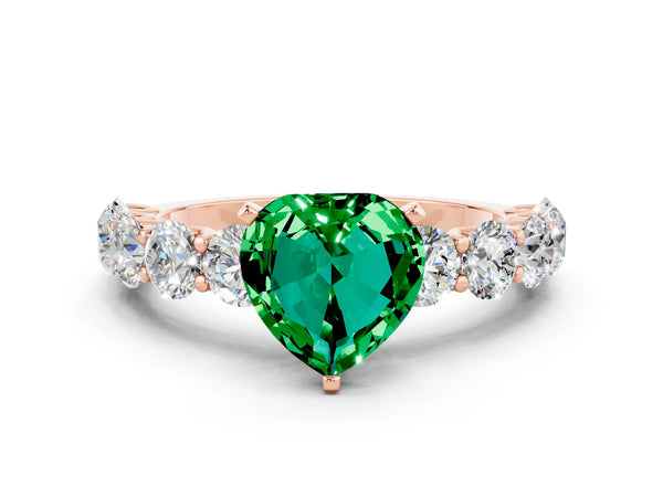 Rose gold Heart Cut Emerald Prong Setting with Side Stones on a Pave Band