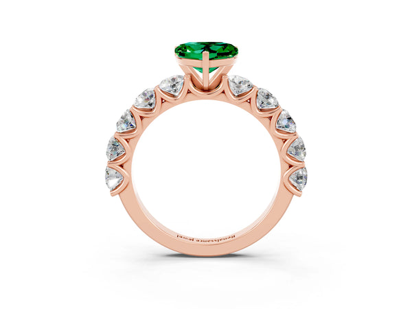 Rose gold Heart Cut Emerald Prong Setting with Side Stones on a Pave Band