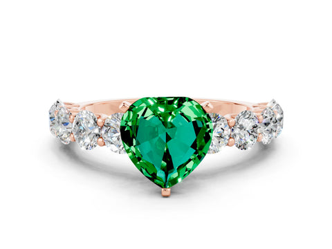 Rose gold Heart Cut Emerald Prong Setting with Side Stones on a Pave Band