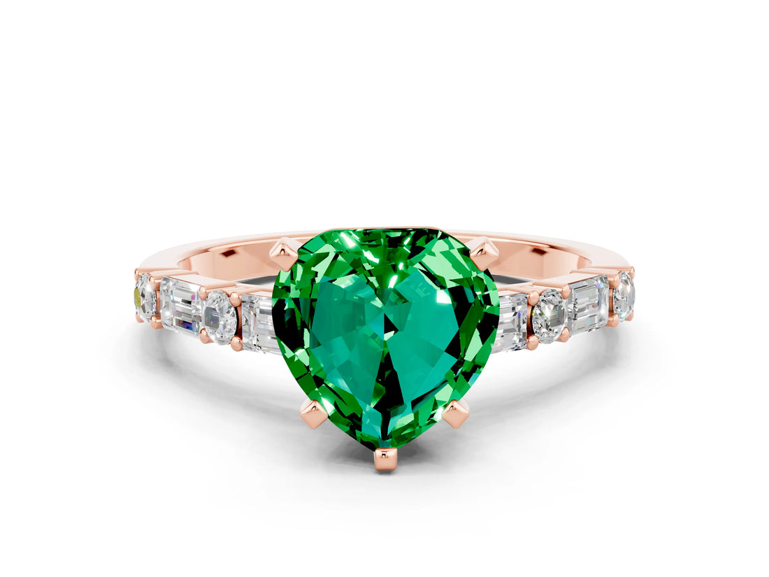 Rose gold Heart Cut Emerald Solitaire with Side Baguettes and Channel Set Band