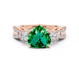 Rose gold Heart Cut Emerald Three-Stone Ring with Pavé Split Shank and Four-Prong Setting