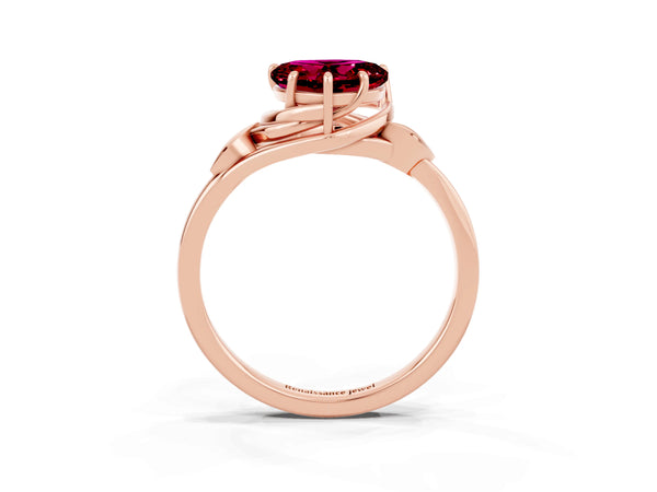 Rose gold Heart Cut Garnet Solitaire Ring with Twist Band and Four-Prong Setting