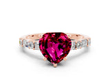 Rose gold Heart Cut Garnet Solitaire with Side Baguettes and Channel Set Band