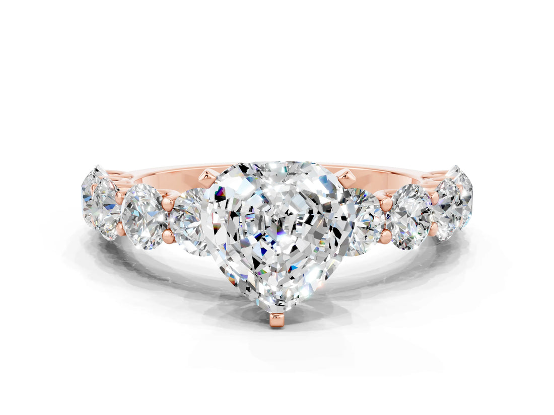 Rose gold Heart Cut Moissanite Prong Setting with Side Stones on a Pave Band