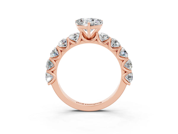 Rose gold Heart Cut Moissanite Prong Setting with Side Stones on a Pave Band