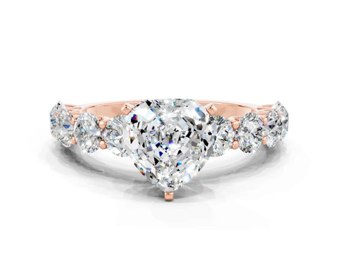 Rose gold Heart Cut Moissanite Prong Setting with Side Stones on a Pave Band