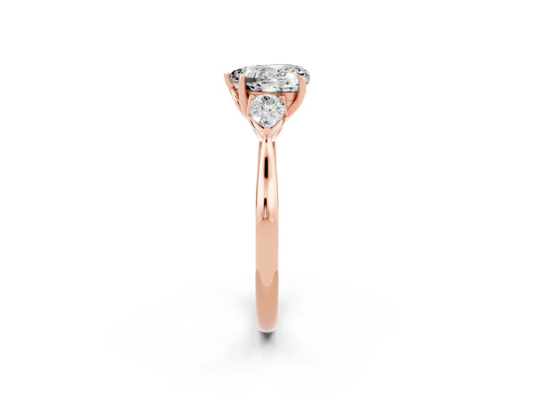 Rose gold Heart Cut Moissanite Three-Stone Ring with Pear  Side Stones and Prong Setting
