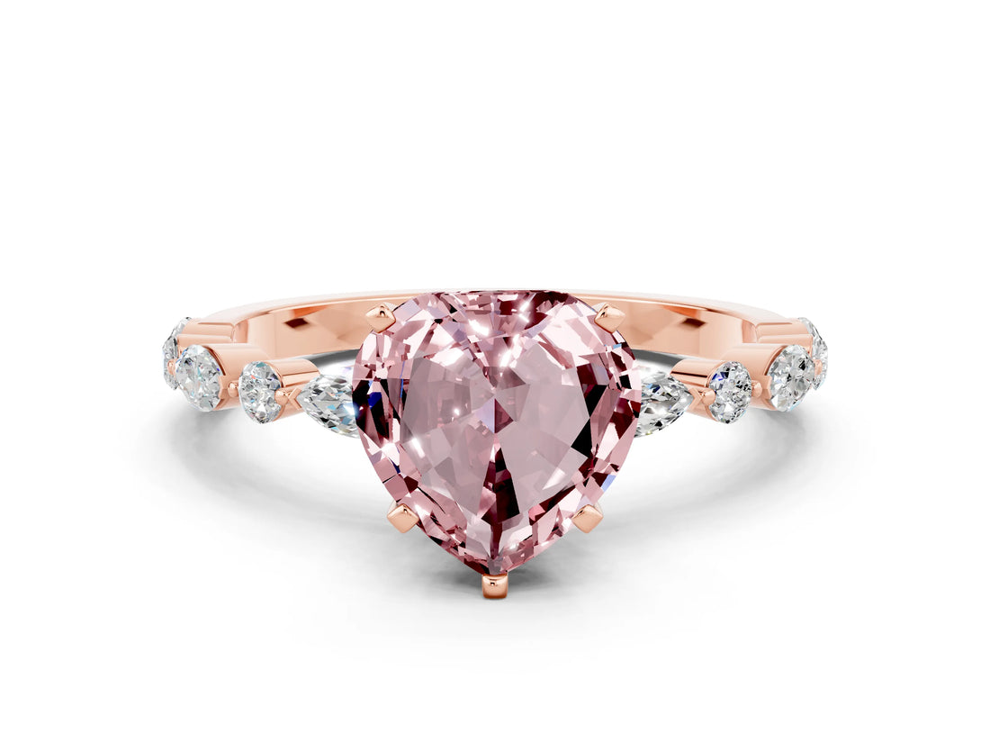 Rose gold Heart Cut Morganite Solitaire with Side Stones on a Pavé Band and Four-Prong Setting