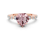 Rose gold Heart Cut Morganite Solitaire with Side Stones on a Pavé Band and Four-Prong Setting