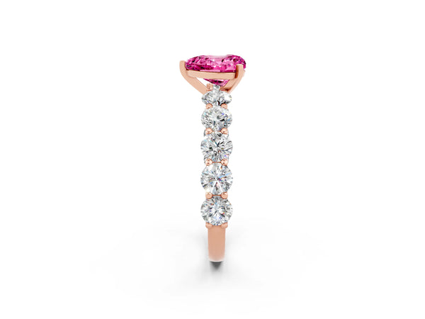 Rose gold Heart Cut Pink Sapphire Prong Setting with Side Stones on a Pave Band