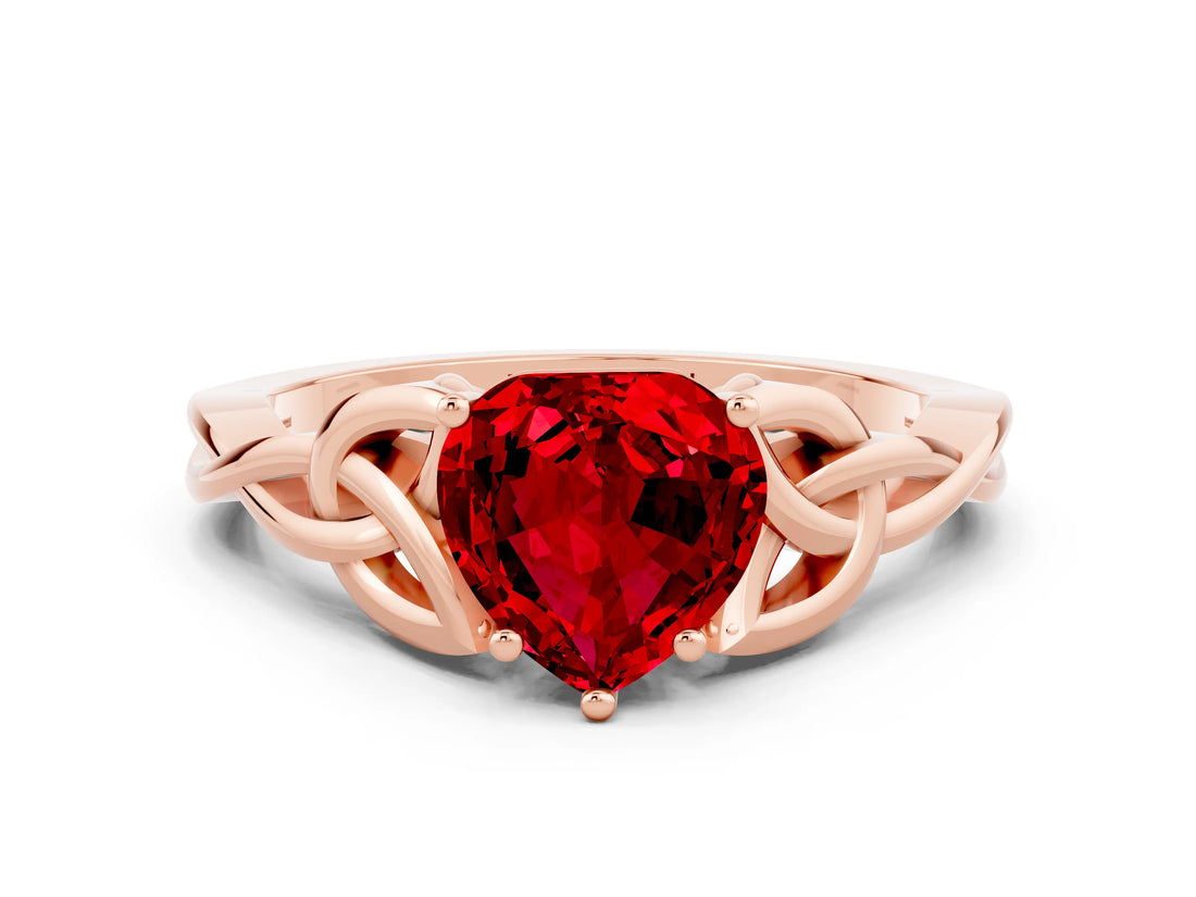 Rose gold Heart Cut Ruby Solitaire Engagement Ring with Celtic Knot Band and Four-Prong Setting
