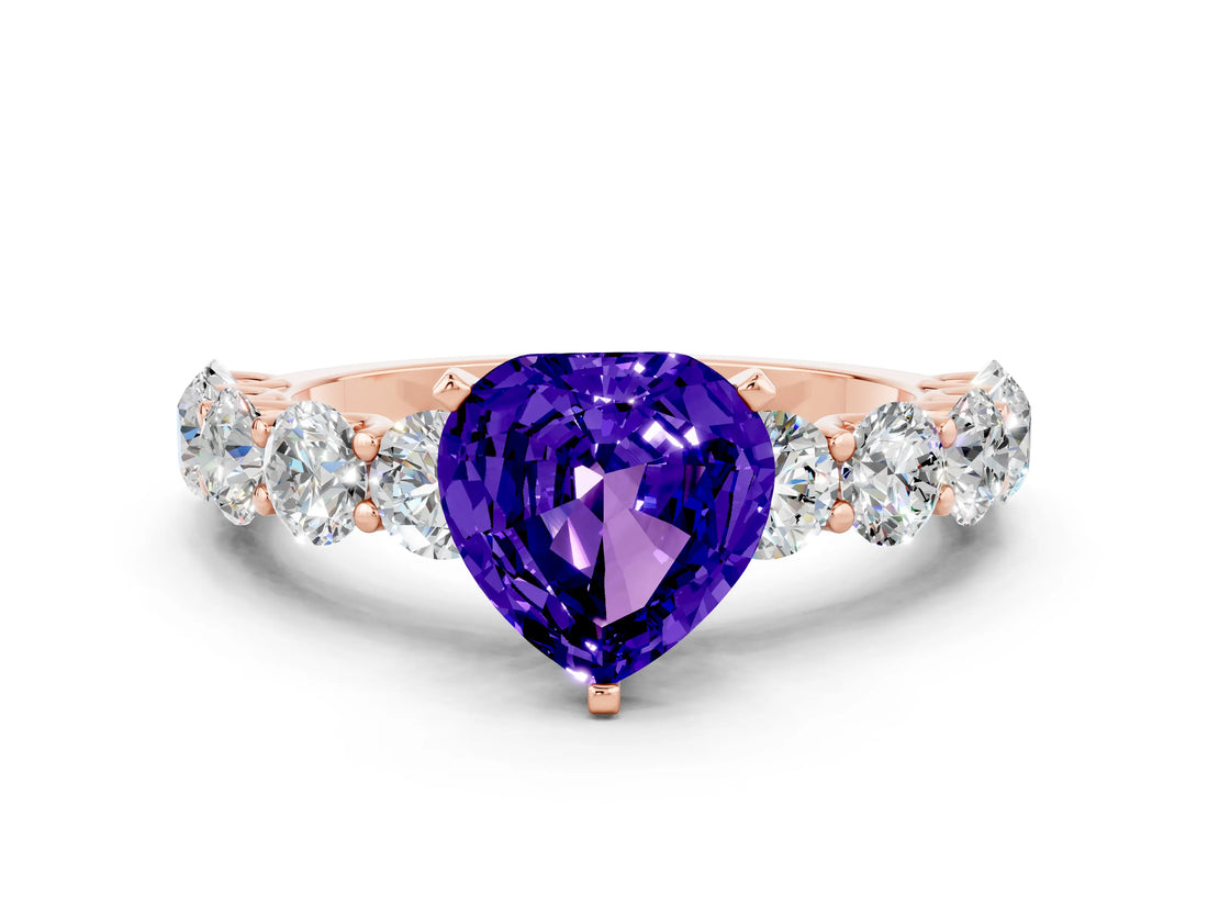 Rose gold Heart Cut Tanzanite Prong Setting with Side Stones on a Pave Band