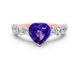 Rose gold Heart Cut Tanzanite Prong Setting with Side Stones on a Pave Band