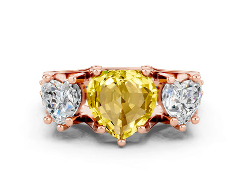 Rose gold Heart Cut Yellow Sapphire Three-Stone Ring with Channel Set Band and Four-Prong Setting
