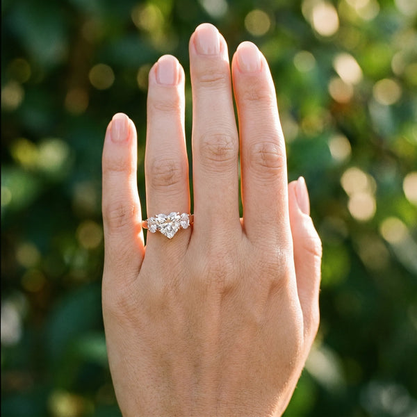 Rose gold Heart Three-Stone Diamond Ring with Prong Setting on a Classic Band