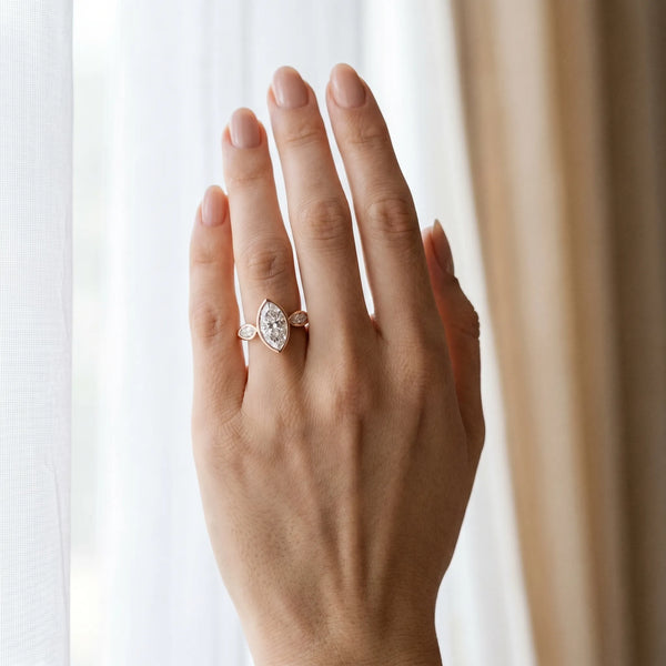 Rose gold Marquise Brilliant Channel-Set Diamond Ring with Bezel Prong Setting