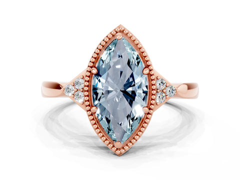 Rose gold Marquise Cut Aquamarine Halo Ring with Tapered Band and Four-Prong Setting