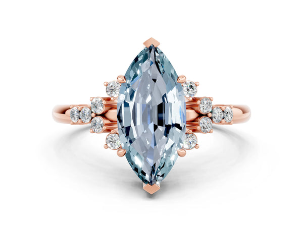 Rose gold Marquise Cut Aquamarine Ring with Side Stones and Four-Prong Setting