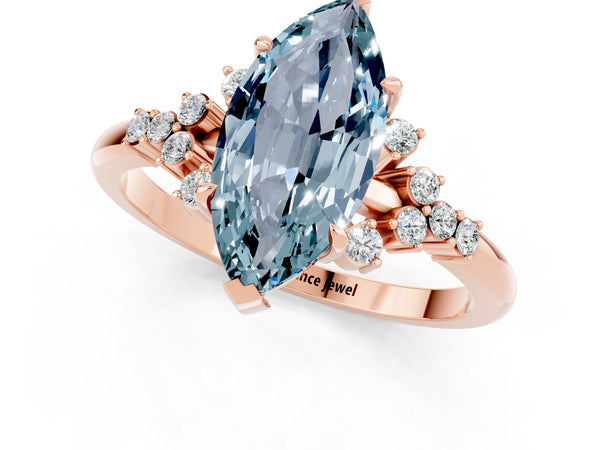 Rose gold Marquise Cut Aquamarine Ring with Side Stones and Four-Prong Setting