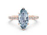 Rose gold Marquise Cut Aquamarine Solitaire Engagement Ring with Pavé Band and Four-Prong Setting
