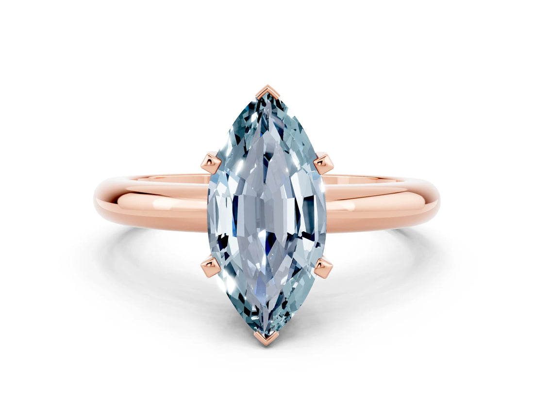 Rose gold Marquise Cut Aquamarine Solitaire Engagement Ring with Round Band and Four-Prong Setting