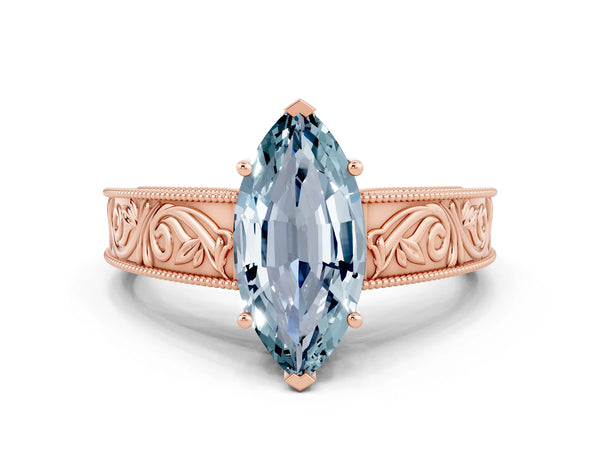 Rose gold Marquise Cut Aquamarine Solitaire Ring with Engraved Band and Four-Prong Setting