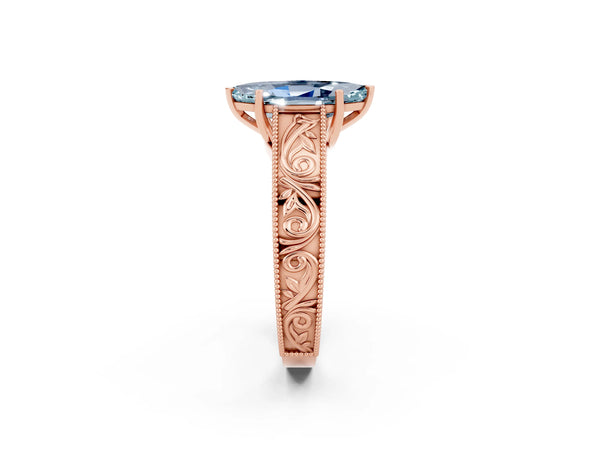 Rose gold Marquise Cut Aquamarine Solitaire Ring with Engraved Band and Four-Prong Setting