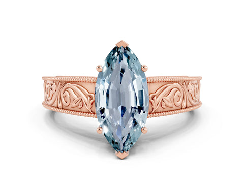 Rose gold Marquise Cut Aquamarine Solitaire Ring with Engraved Band and Four-Prong Setting