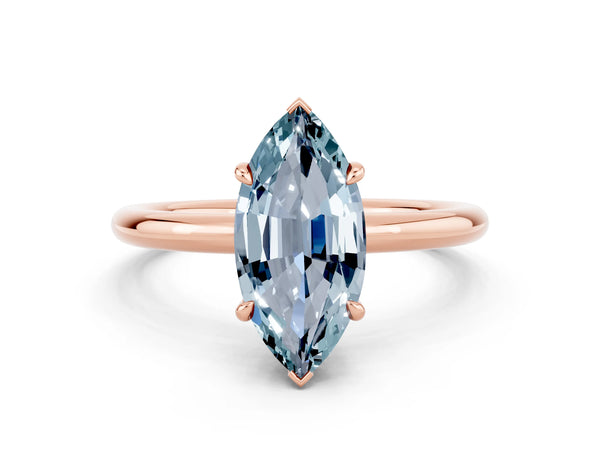 Rose gold Marquise Cut Aquamarine Solitaire Ring with Thin Band and Four-Prong Setting