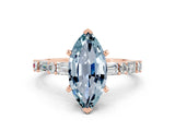 Rose gold Marquise Cut Aquamarine Solitaire with Side Baguettes and Channel Set Band
