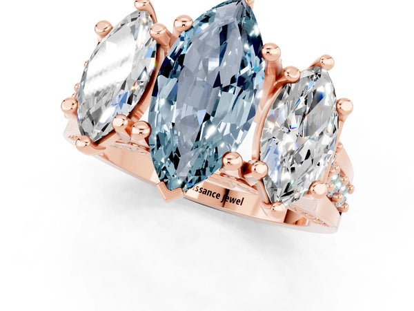 Rose gold Marquise Cut Aquamarine Three-Stone Ring with Channel Set Band and Four-Prong Setting