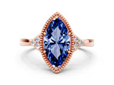 Rose gold Marquise Cut Blue Sapphire Halo Ring with Tapered Band and Four-Prong Setting