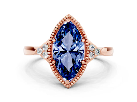 Rose gold Marquise Cut Blue Sapphire Halo Ring with Tapered Band and Four-Prong Setting
